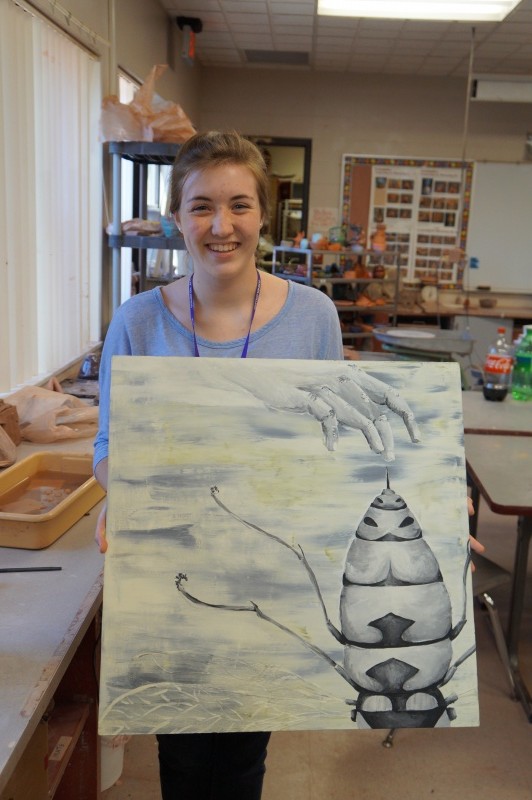Ellie Hathaway, who gold at the national level, with another piece of her artwork